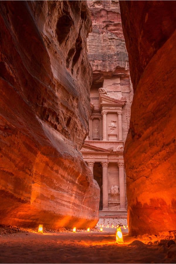 Treasury in Petra at night visible from the end of the Siq